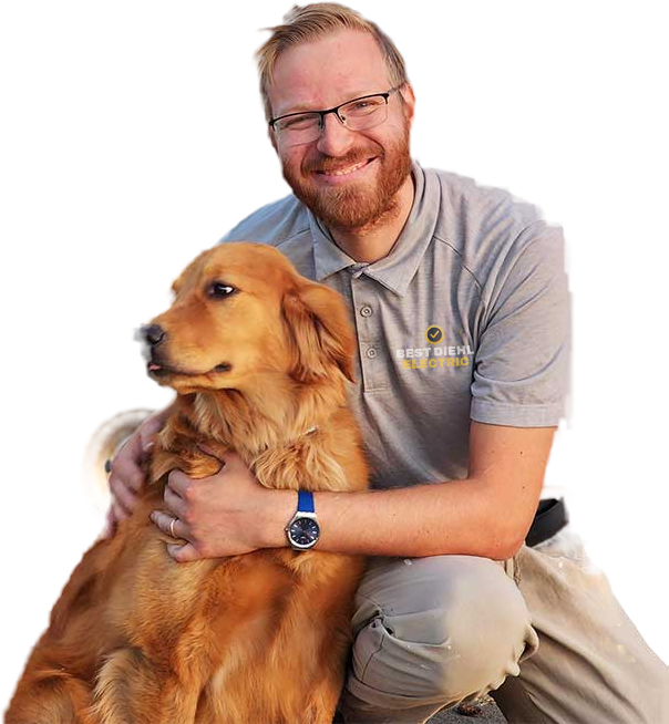 Craig Diehl, owner of Best Diehl Electric, with his golden retriever